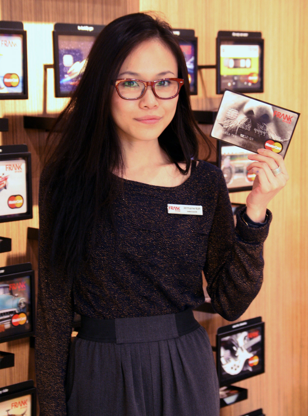 A woman poses with a FRANK by OCBC card design at the brand’s launch event